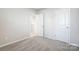 Carpeted bedroom with access to entry and closet at 2405 Hedgecliff Rd, Kannapolis, NC 28025