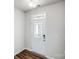Bright foyer features a white front door with glass panes and wood flooring at 2405 Hedgecliff Rd, Kannapolis, NC 28025