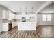 Modern kitchen featuring stainless steel appliances, white cabinets, and a center island with pendant lighting at 2405 Hedgecliff Rd, Kannapolis, NC 28025