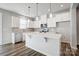Modern kitchen with white cabinetry, stainless steel appliances, and a center island at 2405 Hedgecliff Rd, Kannapolis, NC 28025