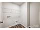 Spacious laundry room with modern flooring and convenient hookups at 2405 Hedgecliff Rd, Kannapolis, NC 28025