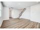 Bright and open living room features luxury vinyl plank flooring and a staircase at 2405 Hedgecliff Rd, Kannapolis, NC 28025