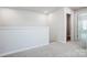 Bright, carpeted loft area with access to an adjacent bedroom at 2405 Hedgecliff Rd, Kannapolis, NC 28025