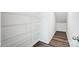Ample storage available inside the walk-in pantry with wire shelving units and vinyl floors at 2405 Hedgecliff Rd, Kannapolis, NC 28025
