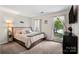 Bright bedroom features neutral tones, plush carpet, and two windows with sheer curtains at 2635 Clover Hill Ln, Charlotte, NC 28215
