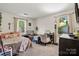 This cozy room features two twin beds, a desk, and carpeted floors at 2635 Clover Hill Ln, Charlotte, NC 28215