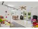Bright dining area with tile floors, featuring a wood table set for six, and patio access at 2635 Clover Hill Ln, Charlotte, NC 28215