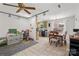 Inviting dining area with tile flooring, ceiling fan, and a view into the adjacent kitchen space at 2635 Clover Hill Ln, Charlotte, NC 28215