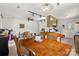 Spacious dining area with tiled floors, track lighting, and a large wooden dining table at 2635 Clover Hill Ln, Charlotte, NC 28215