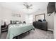 Comfortable bedroom features a ceiling fan, neutral paint colors, and dark wood dresser at 2754 Legacy Ridge Ln, Catawba, NC 28609