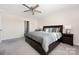 Spacious bedroom boasts a ceiling fan, ensuite bathroom access, and plush carpeting at 2754 Legacy Ridge Ln, Catawba, NC 28609