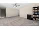 Inviting bonus room featuring plush gray carpeting, a stylish ceiling fan, and ample space for furniture and activities at 2754 Legacy Ridge Ln, Catawba, NC 28609