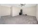 Spacious bonus room with neutral walls, ceiling fan, and plush carpeting; versatile for living, playing, or workout space at 2754 Legacy Ridge Ln, Catawba, NC 28609