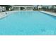 Sun-drenched swimming pool surrounded by a concrete deck and neighborhood homes at 2754 Legacy Ridge Ln, Catawba, NC 28609
