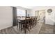 Comfortable dining area featuring a large wood table, seating for eight, wood floors, and natural lighting at 2754 Legacy Ridge Ln, Catawba, NC 28609