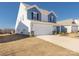 Two-story home featuring a two-car garage and manicured lawn set against a clear blue sky at 2754 Legacy Ridge Ln, Catawba, NC 28609