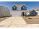 Charming two-story home featuring a two-car garage, blue and white siding, and a well-maintained front yard at 2754 Legacy Ridge Ln, Catawba, NC 28609