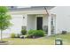 Charming home entrance featuring a well-manicured garden and an inviting covered porch at 2754 Legacy Ridge Ln, Catawba, NC 28609