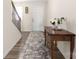 Front hallway area with long carpet runner, wooden side table, and white front door at 2754 Legacy Ridge Ln, Catawba, NC 28609