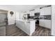 Modern kitchen with white cabinets, stainless steel appliances, large island, and stylish backsplash at 2754 Legacy Ridge Ln, Catawba, NC 28609