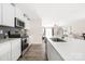 Contemporary kitchen with white countertops, stainless steel appliances, subway tile backsplash, and hardwood floors at 2754 Legacy Ridge Ln, Catawba, NC 28609