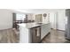 Bright kitchen area featuring an island with counter seating and stainless steel dishwasher at 2754 Legacy Ridge Ln, Catawba, NC 28609