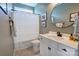 Bathroom featuring a vanity with a round mirror, faucet, and shower with curtain at 3424 Saint Clair Nw Ct, Concord, NC 28027