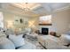 Bright, open living room with a fireplace, stylish furniture, and coffered ceiling at 3424 Saint Clair Nw Ct, Concord, NC 28027