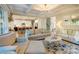 Bright living room flows into modern kitchen and features stylish decor, hardwood floors, and coffered ceilings at 3424 Saint Clair Nw Ct, Concord, NC 28027