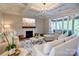 Bright, open living room with a fireplace, coffered ceiling, and sliding doors to an outdoor space at 3424 Saint Clair Nw Ct, Concord, NC 28027