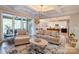 Bright living room flows into modern kitchen and features stylish decor, hardwood floors, and coffered ceilings at 3424 Saint Clair Nw Ct, Concord, NC 28027