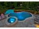 Aerial view of inviting pool with spa, travertine tile, and manicured landscaping at 3424 Saint Clair Nw Ct, Concord, NC 28027