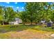 Spacious barn on a sprawling lot, surrounded by lush greenery and offering ample storage at 3755 River Rd, Richfield, NC 28137