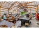 Open barn interior showing a pool table, seating, and various equipment at 3755 River Rd, Richfield, NC 28137