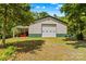 Well-maintained barn with a roll-up door, lean-to, and visible storage space at 3755 River Rd, Richfield, NC 28137