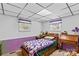 Cozy bedroom featuring a single bed with a colorful quilt and natural light from two windows at 3755 River Rd, Richfield, NC 28137