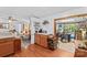 Traditional kitchen with warm wood cabinets, hardwood floors, and an adjacent dining area at 3755 River Rd, Richfield, NC 28137