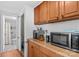 Kitchen featuring wood cabinets, modern appliances, and adjacent bathroom with shower and toilet at 3755 River Rd, Richfield, NC 28137