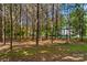 Mature trees with manicured landscaping and a pine-straw-covered ground at 3755 River Rd, Richfield, NC 28137