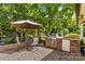Outdoor kitchen with patio and mature landscaping. Great for entertaining! at 3755 River Rd, Richfield, NC 28137