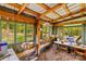 Interior of storage shed with hanging planters and lots of windows at 3755 River Rd, Richfield, NC 28137