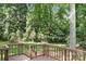 Well-maintained back deck featuring wood railings and stairs, perfect for outdoor entertaining and relaxation at 4316 Old Saybrook Ct, Charlotte, NC 28211