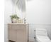 Elegant powder room featuring a designer vanity, brushed gold fixtures, and a modern commode at 4316 Old Saybrook Ct, Charlotte, NC 28211