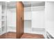 A large walk-in closet featuring custom shelves, drawers, and closet rod for optimal storage at 4316 Old Saybrook Ct, Charlotte, NC 28211