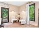 Cozy sitting room features natural light, comfortable seating, and seamless access to the outdoor living space at 4316 Old Saybrook Ct, Charlotte, NC 28211
