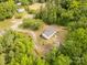 Overhead view of a house with an inviting driveway entrance surrounded by trees at 439 Kershaw Country Club Rd, Kershaw, SC 29067