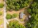 Top-down aerial view of a house with lovely landscaping and green trees at 439 Kershaw Country Club Rd, Kershaw, SC 29067