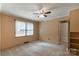 Bedroom featuring paneled walls, carpet flooring, one window providing natural light and a closet at 439 Kershaw Country Club Rd, Kershaw, SC 29067
