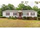 Charming single-story home with red shutters and a well-manicured front yard at 439 Kershaw Country Club Rd, Kershaw, SC 29067