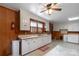 Kitchen view of lots of cabinets, linoleum floors, window and door at 439 Kershaw Country Club Rd, Kershaw, SC 29067